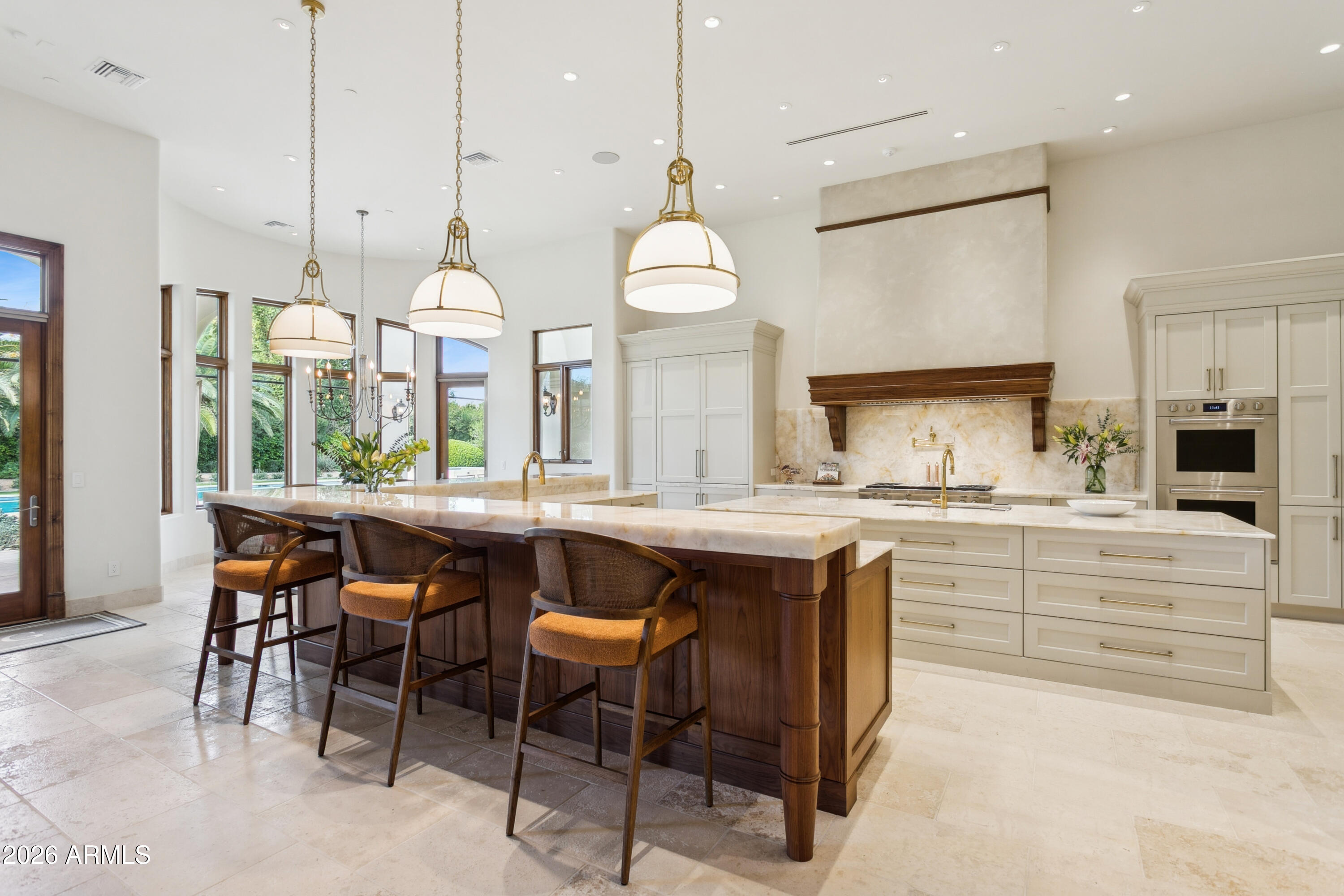 6674 East Judson Road Paradise Valley, AZ 85253 - Photo 17 of 92 a kitchen with stainless steel appliances granite countertop a stove a sink a oven a refrigerator with white cabinets and wooden floor
