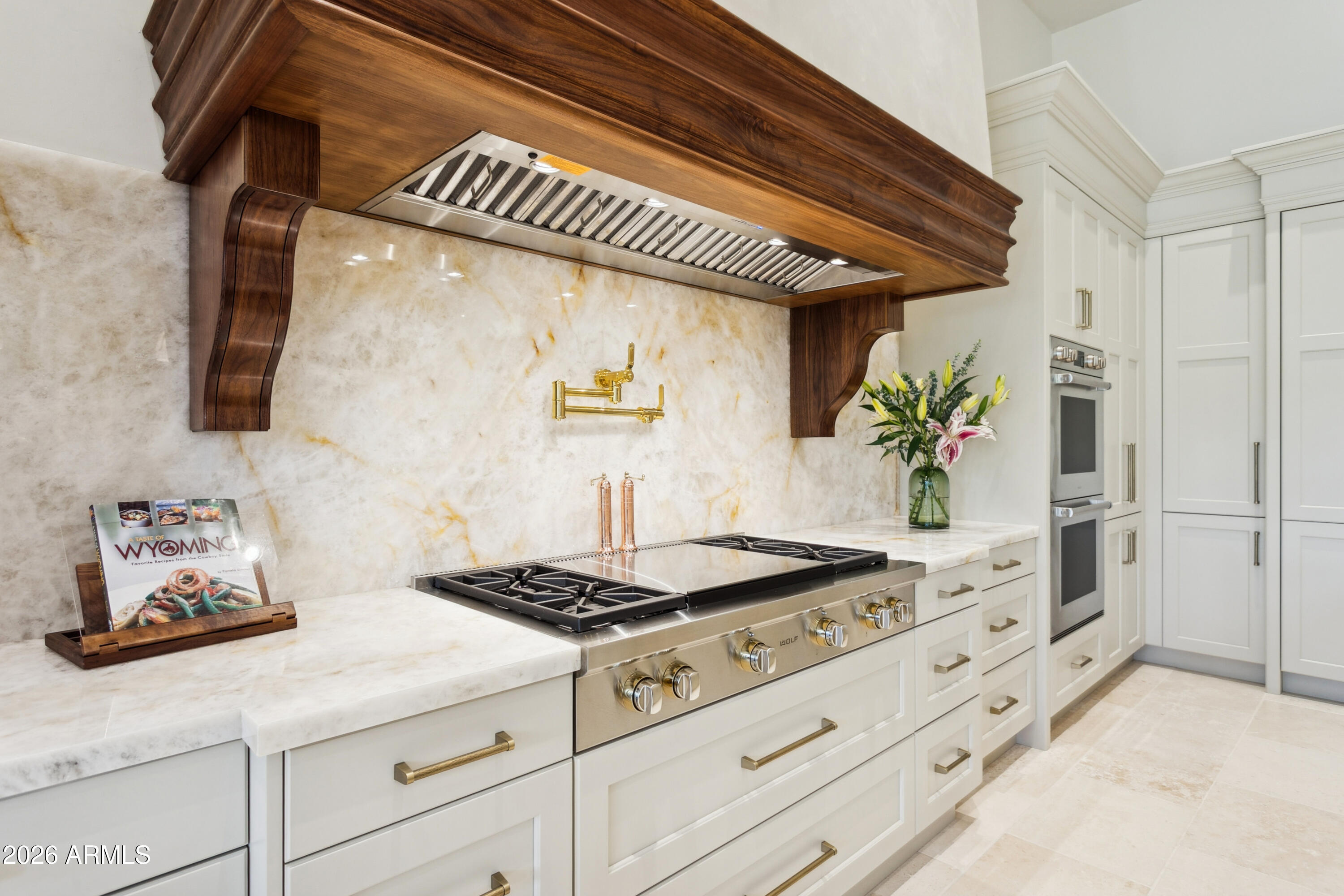 6674 East Judson Road Paradise Valley, AZ 85253 - Photo 22 of 92 a kitchen with stainless steel appliances a white stove top oven and a refrigerator