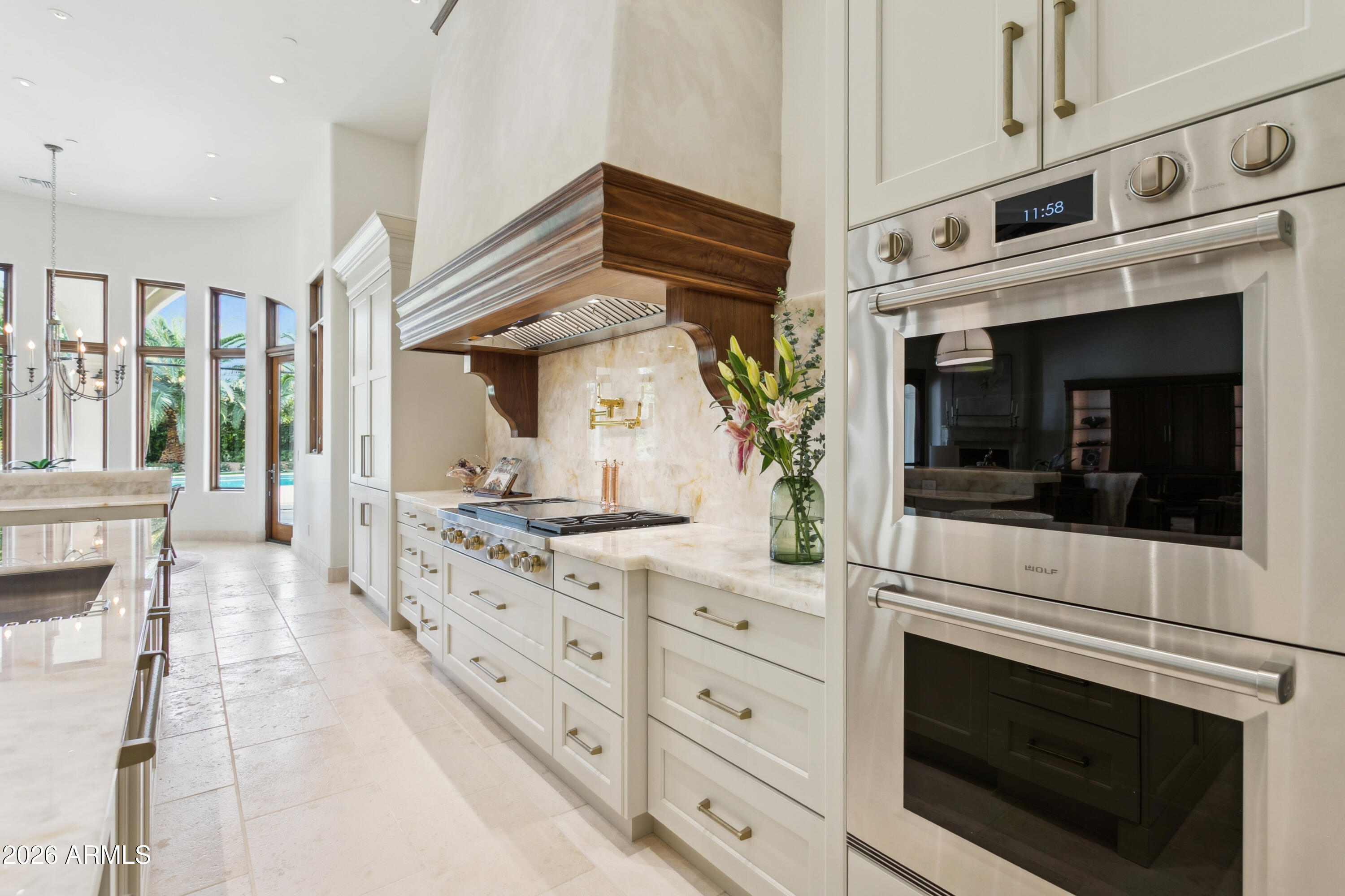 6674 East Judson Road Paradise Valley, AZ 85253 - Photo 24 of 92 a kitchen with granite countertop white cabinets and white appliances