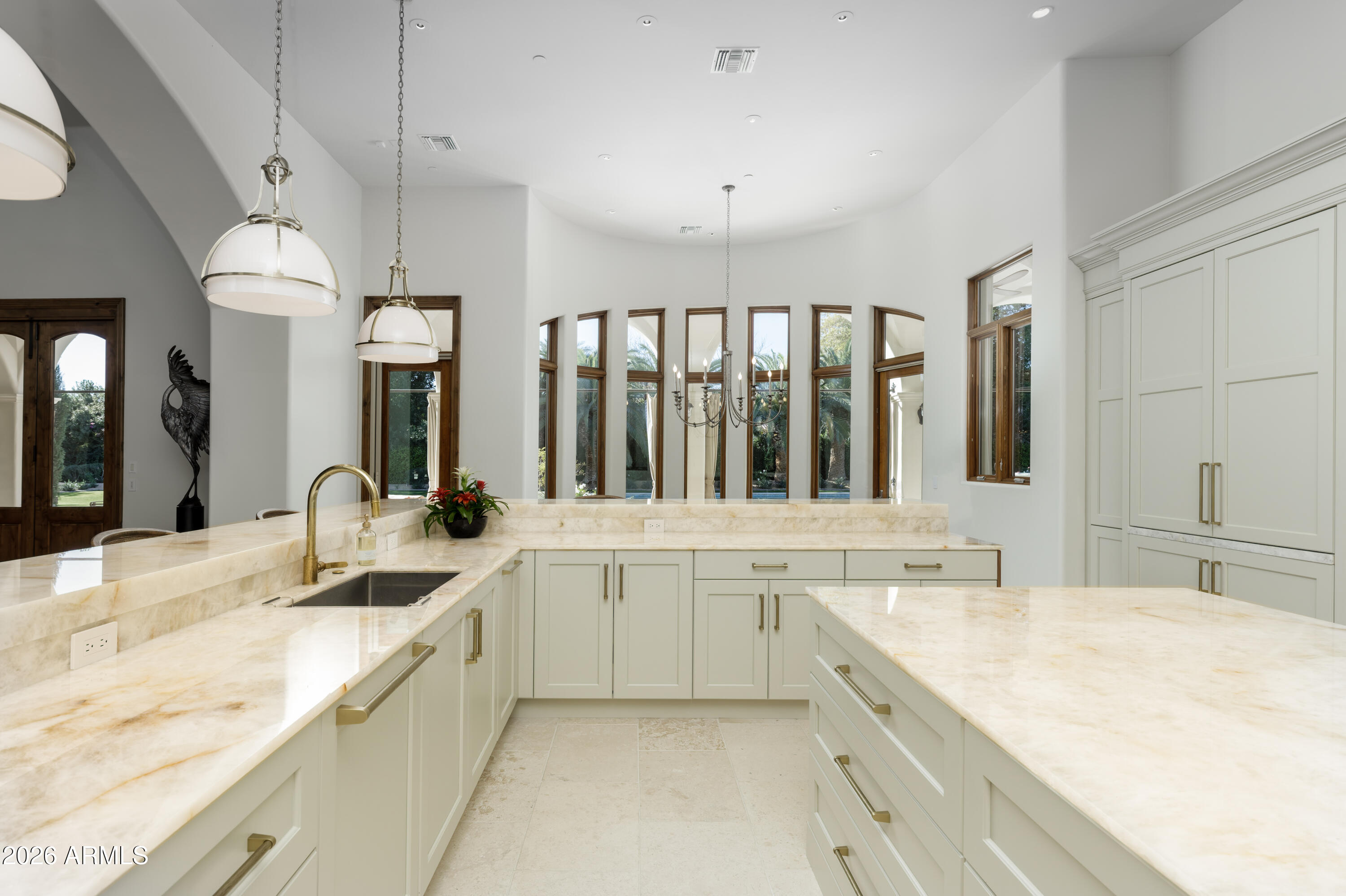 6674 East Judson Road Paradise Valley, AZ 85253 - Photo 28 of 92 a large white kitchen with a sink and cabinets