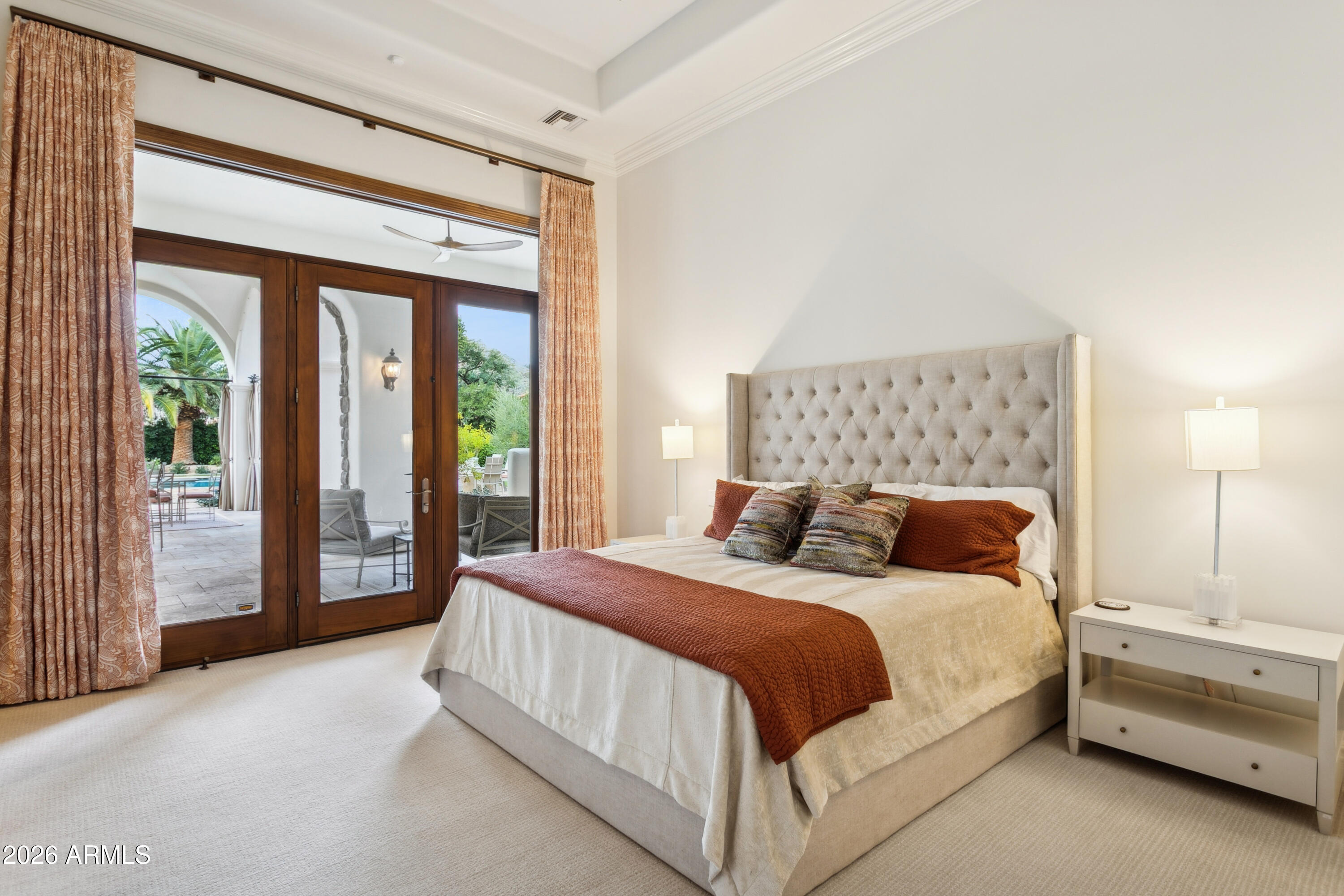 6674 East Judson Road Paradise Valley, AZ 85253 - Photo 48 of 92 a bedroom with a large bed and a large window