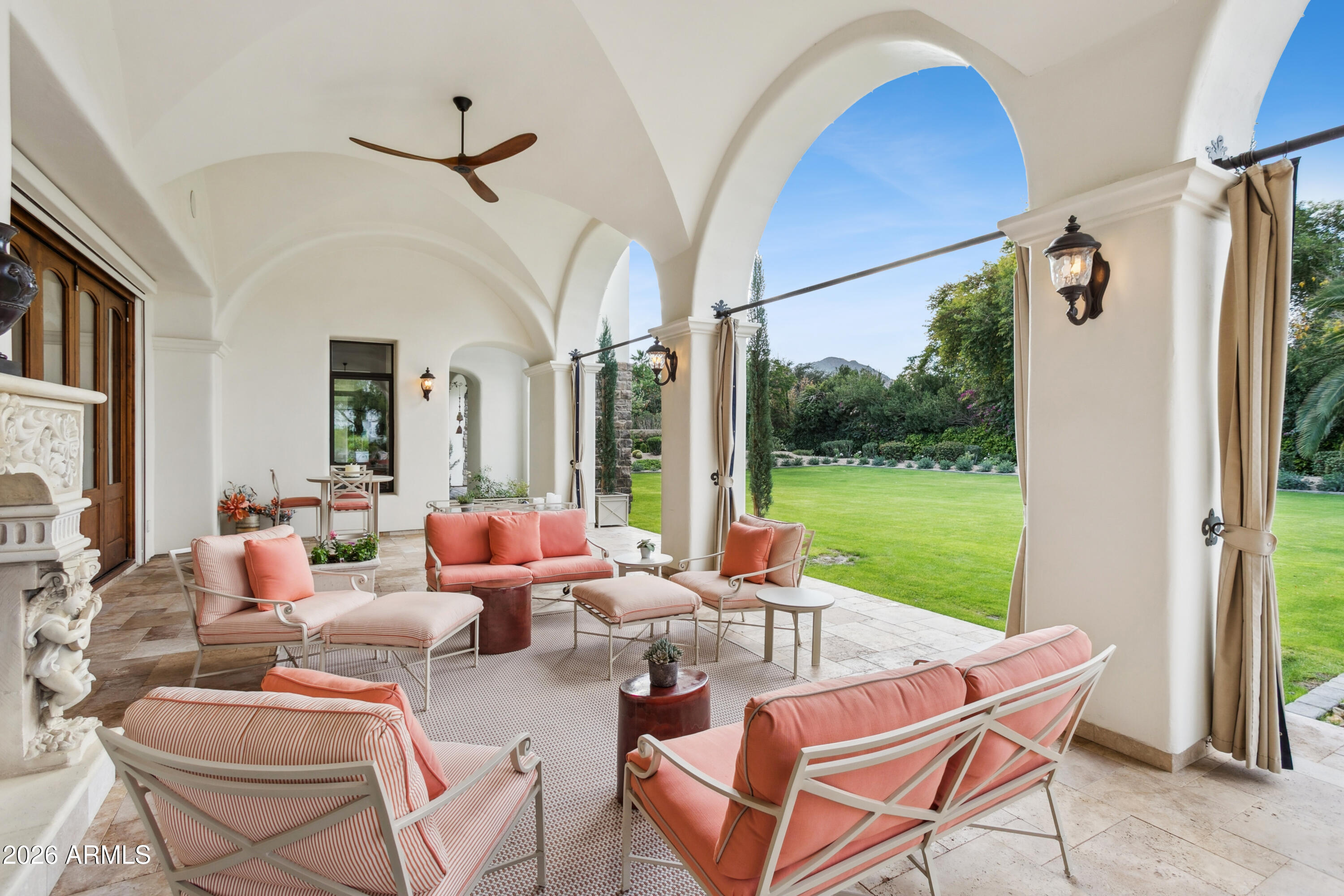 6674 East Judson Road Paradise Valley, AZ 85253 - Photo 59 of 92 a outdoor space with patio the couches and a dining table with garden view