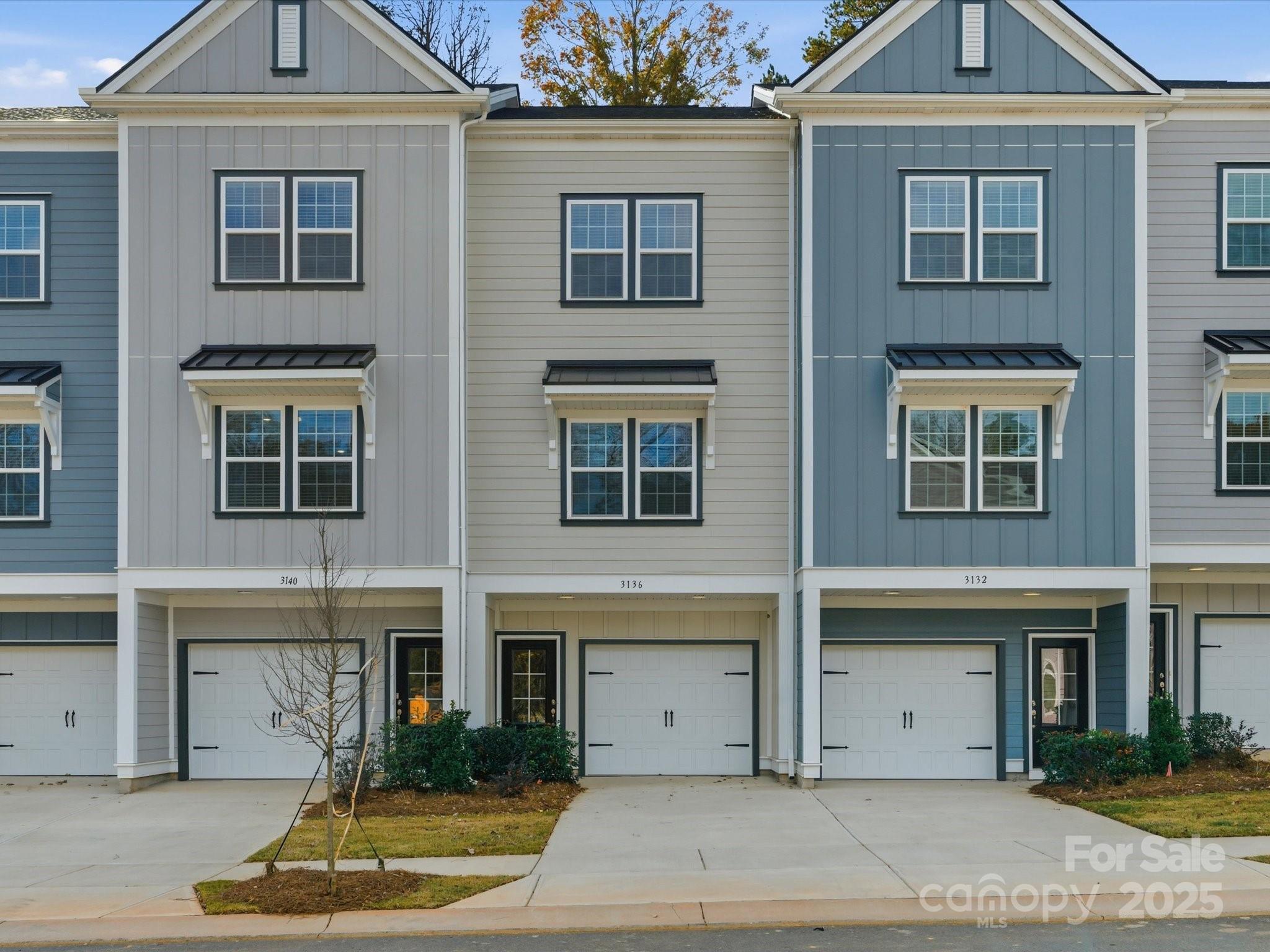 3132 Butler Hl Drive Matthews, NC 28105 - Photo 2 of 36 a front view of a house with garage