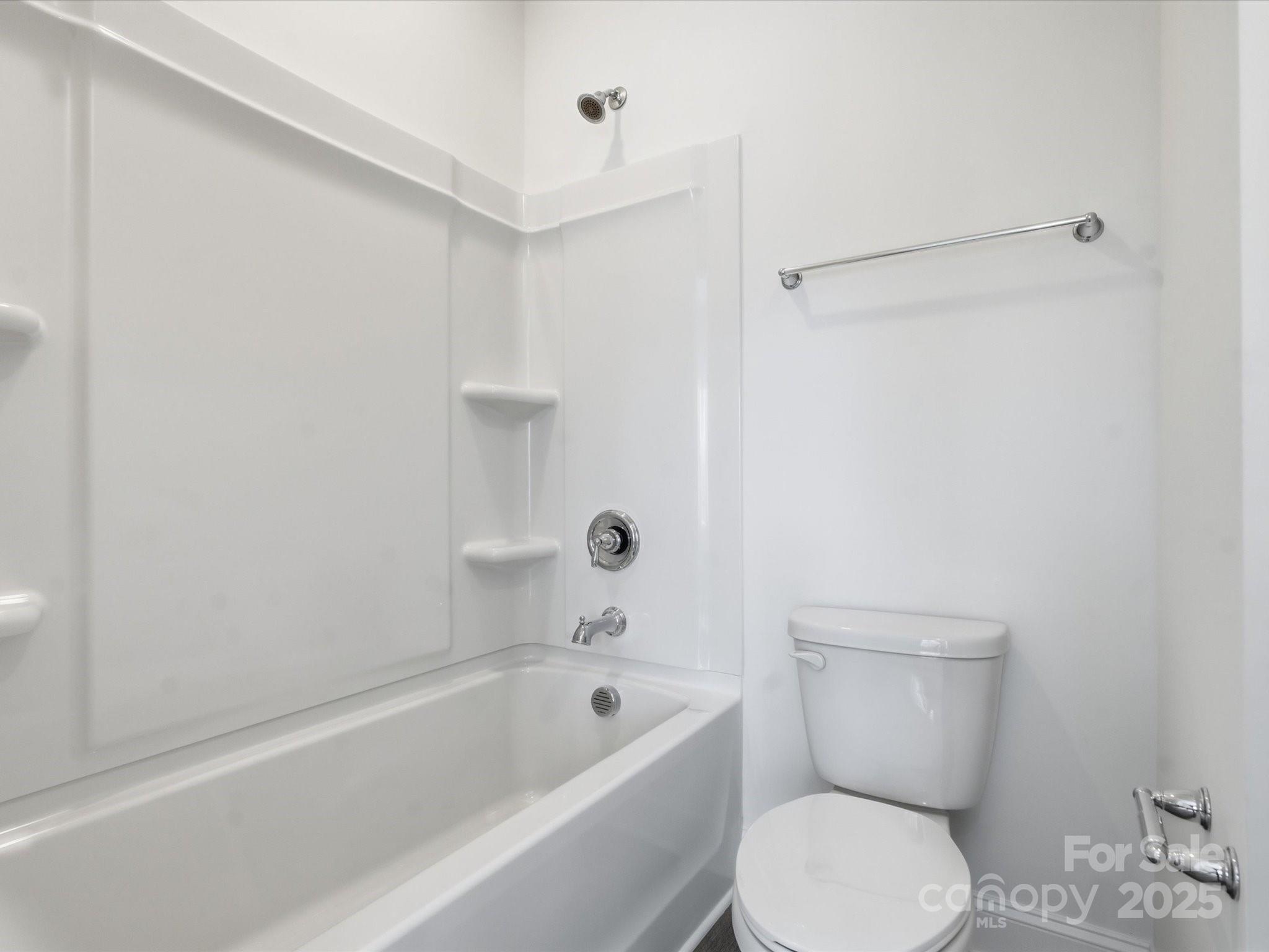 3132 Butler Hl Drive Matthews, NC 28105 - Photo 22 of 36 a white toilet sitting next to a bath tub