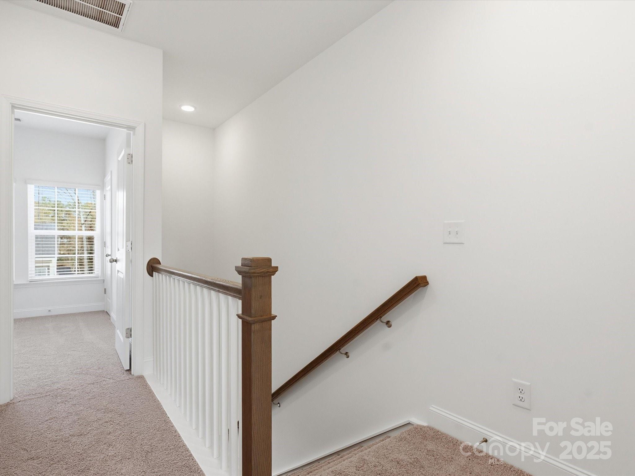 3132 Butler Hl Drive Matthews, NC 28105 - Photo 24 of 36 a view of a hallway with windows