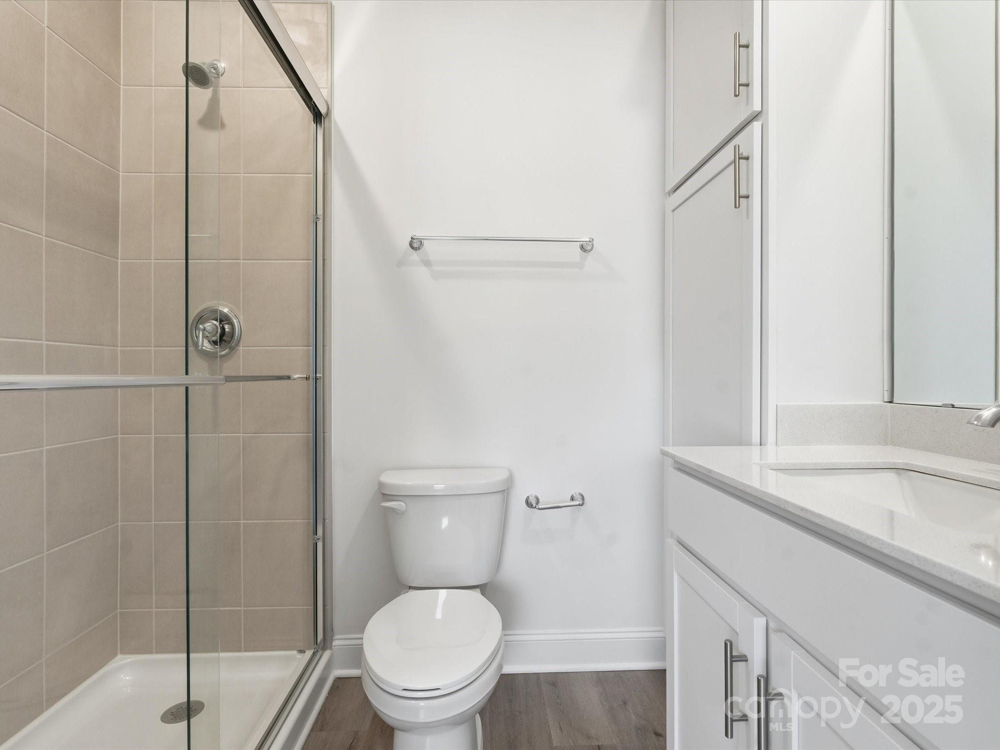 3132 Butler Hl Drive Matthews, NC 28105 - Photo 28 of 36 a bathroom with a granite countertop sink toilet and shower
