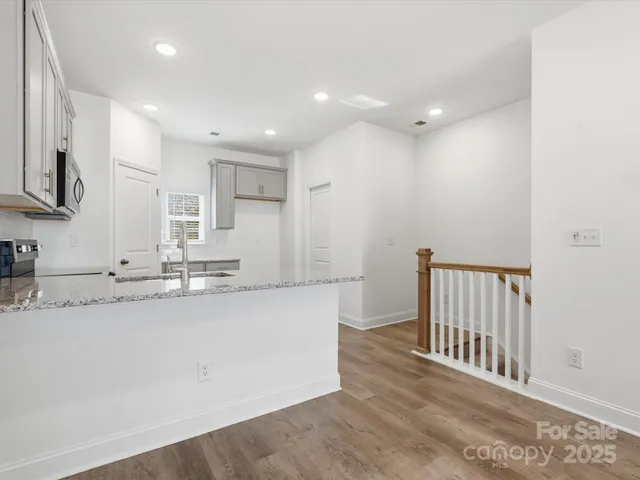 a view of a kitchen with a sink and a window