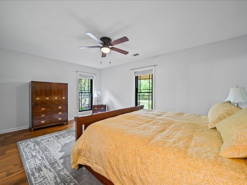 8104 Jack Bond Road Arlington, TN 38002 - Photo 20 of 40 a bedroom with a bed dresser and flat screen tv