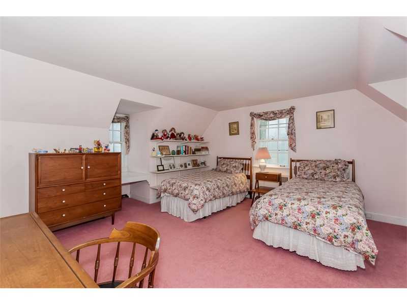 22 Maplewood Drive Darien, CT 06820 - Photo 12 of 25 a bedroom with two beds and a dresser