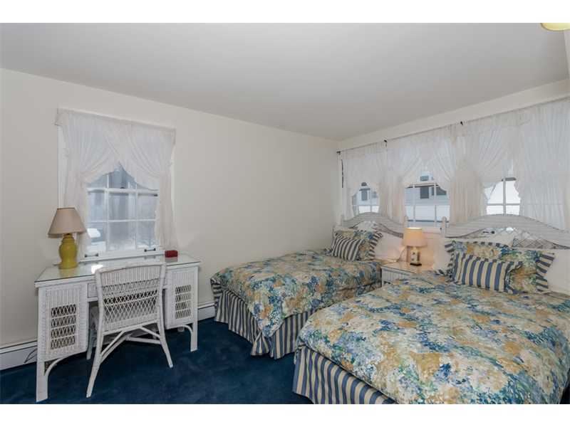22 Maplewood Drive Darien, CT 06820 - Photo 14 of 25 a bedroom with a bed a table and chair