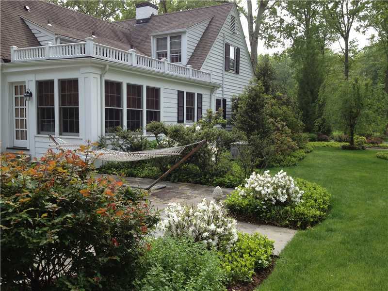 22 Maplewood Drive Darien, CT 06820 - Photo 21 of 25 front view of a house with a yard