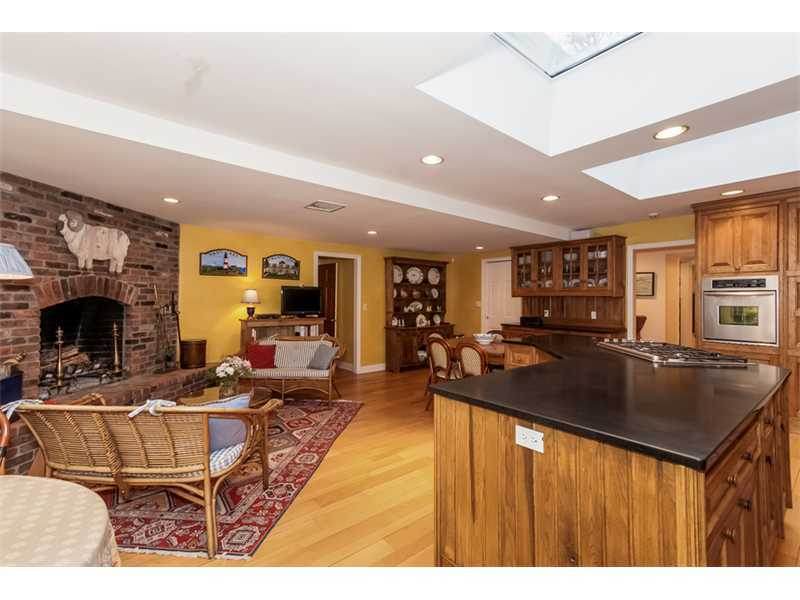 22 Maplewood Drive Darien, CT 06820 - Photo 7 of 25 a living room with stainless steel appliances kitchen island granite countertop a table chairs and a sink