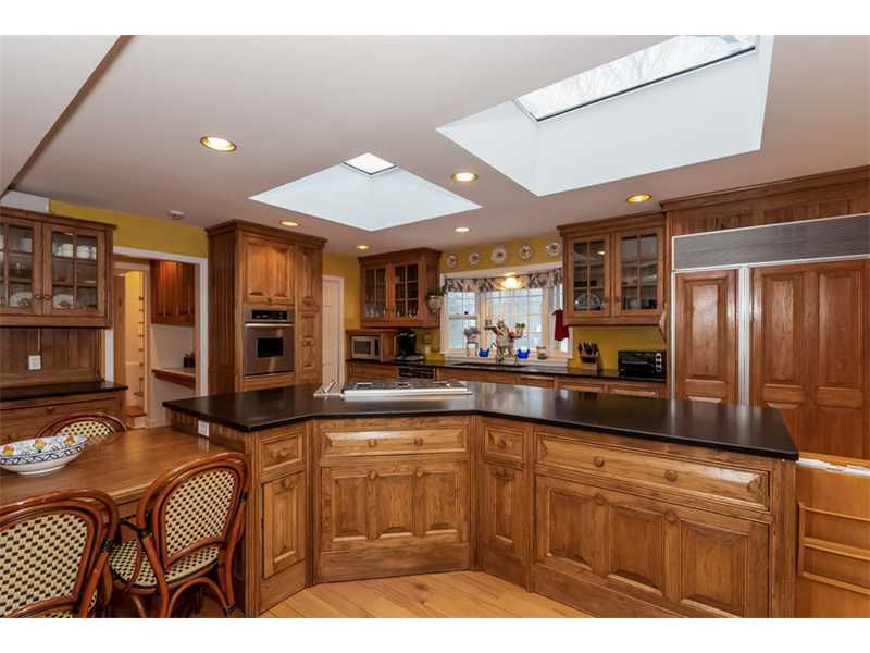22 Maplewood Drive Darien, CT 06820 - Photo 9 of 25 a kitchen with stainless steel appliances granite countertop a sink and cabinets