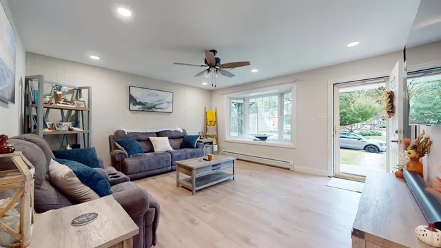 a living room with furniture and a large window