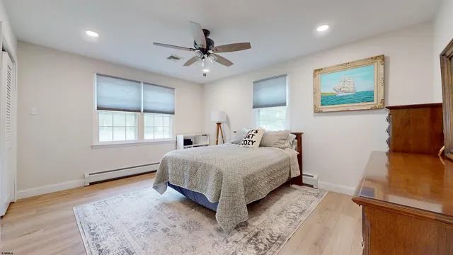 a living room with a bed furniture and a window