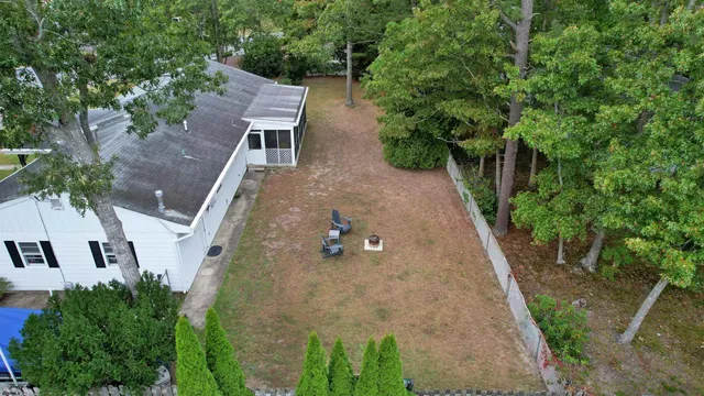 an aerial view of a house with outdoor space