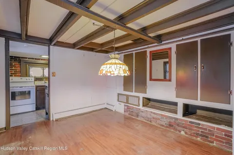 a view of a hallway with entryway and chandelier