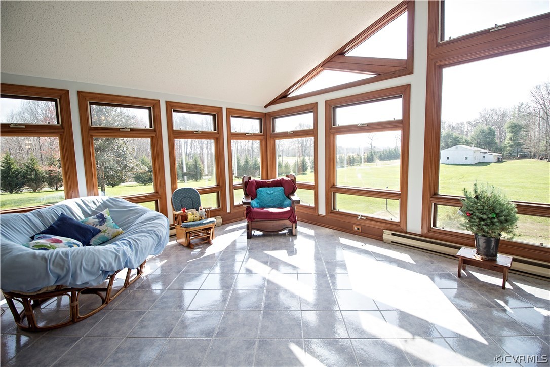 789 Bagby Road Bumpass, VA 23024 - Photo 8 of 40 a living room with furniture and floor to ceiling windows