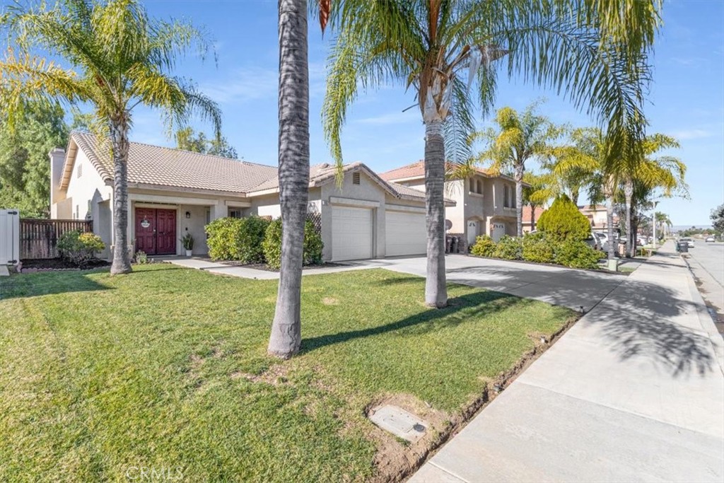 26637 Trumble Road Menifee, CA 92585 - Photo 1 of 1 a view of a house with a yard and palm trees