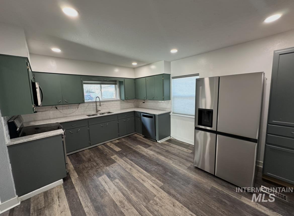 1503 10th Avenue Lewiston, ID 83501 - Photo 12 of 48 Good size kitchen with quartz counter tops, new backsplash, and all new appliances. Has room for a small dining nook too.