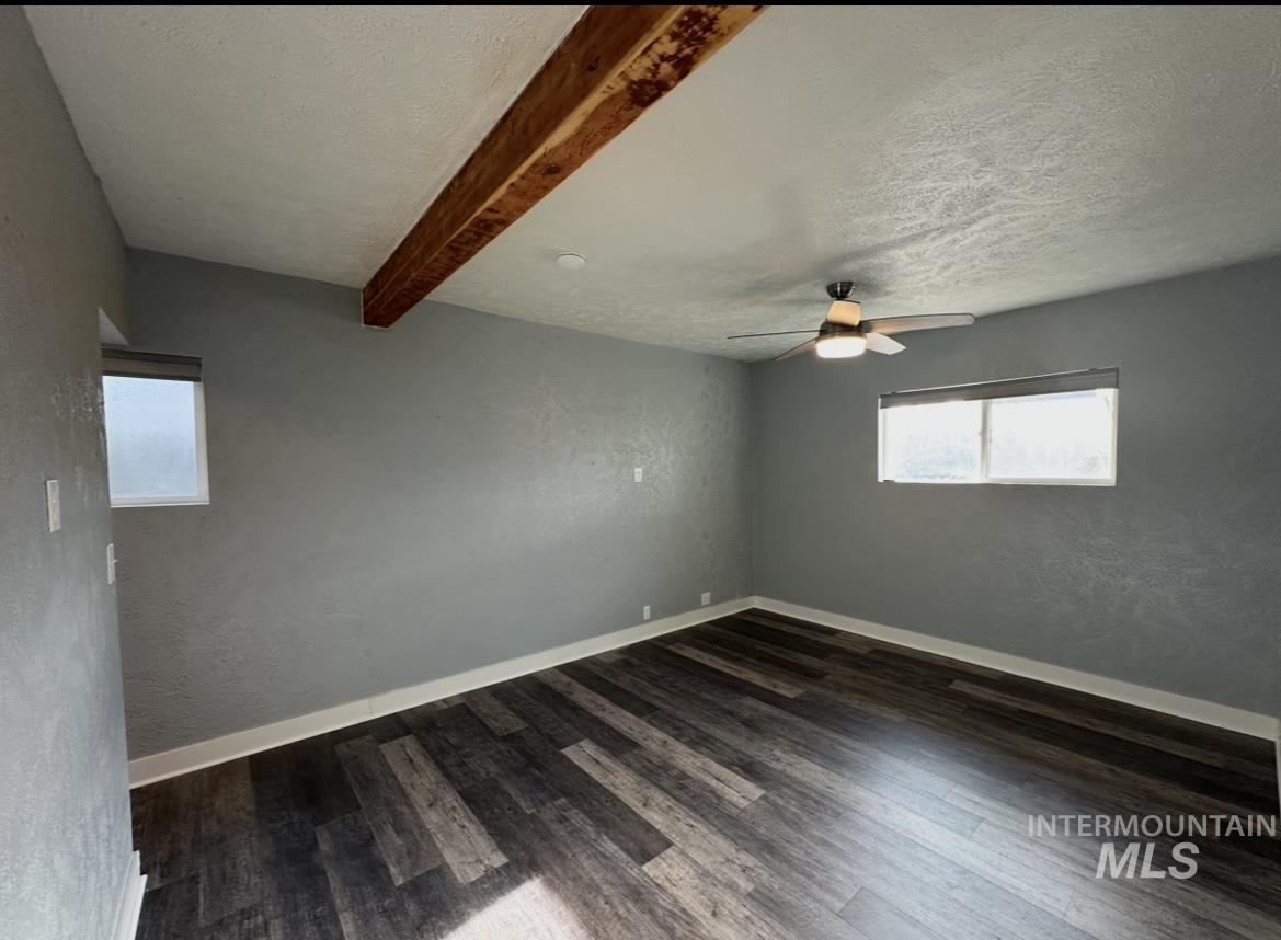 1503 10th Avenue Lewiston, ID 83501 - Photo 19 of 50 Large master bedroom with exposed beam and space big enough for a king sized bed and more.