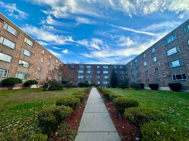 a view of a pathway with a yard
