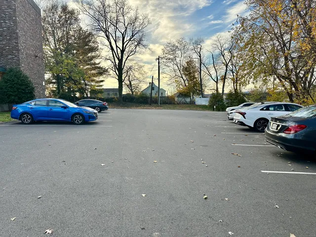 a view of street with parked cars