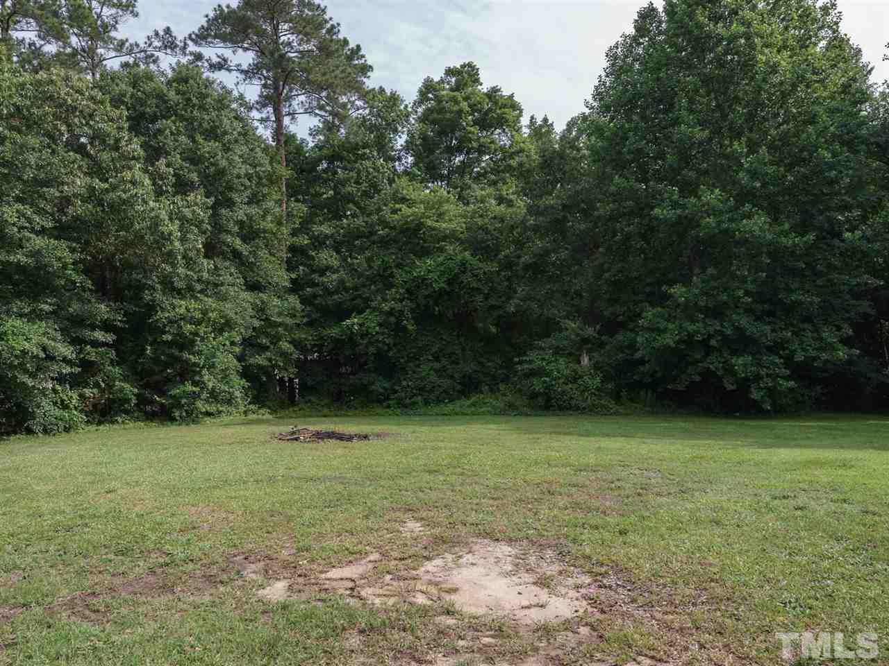 5692 Zacks Mill Road Angier, NC 27501 - Photo 21 of 25 a view of a field with a trees