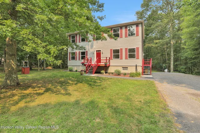 a view of a house with a back yard