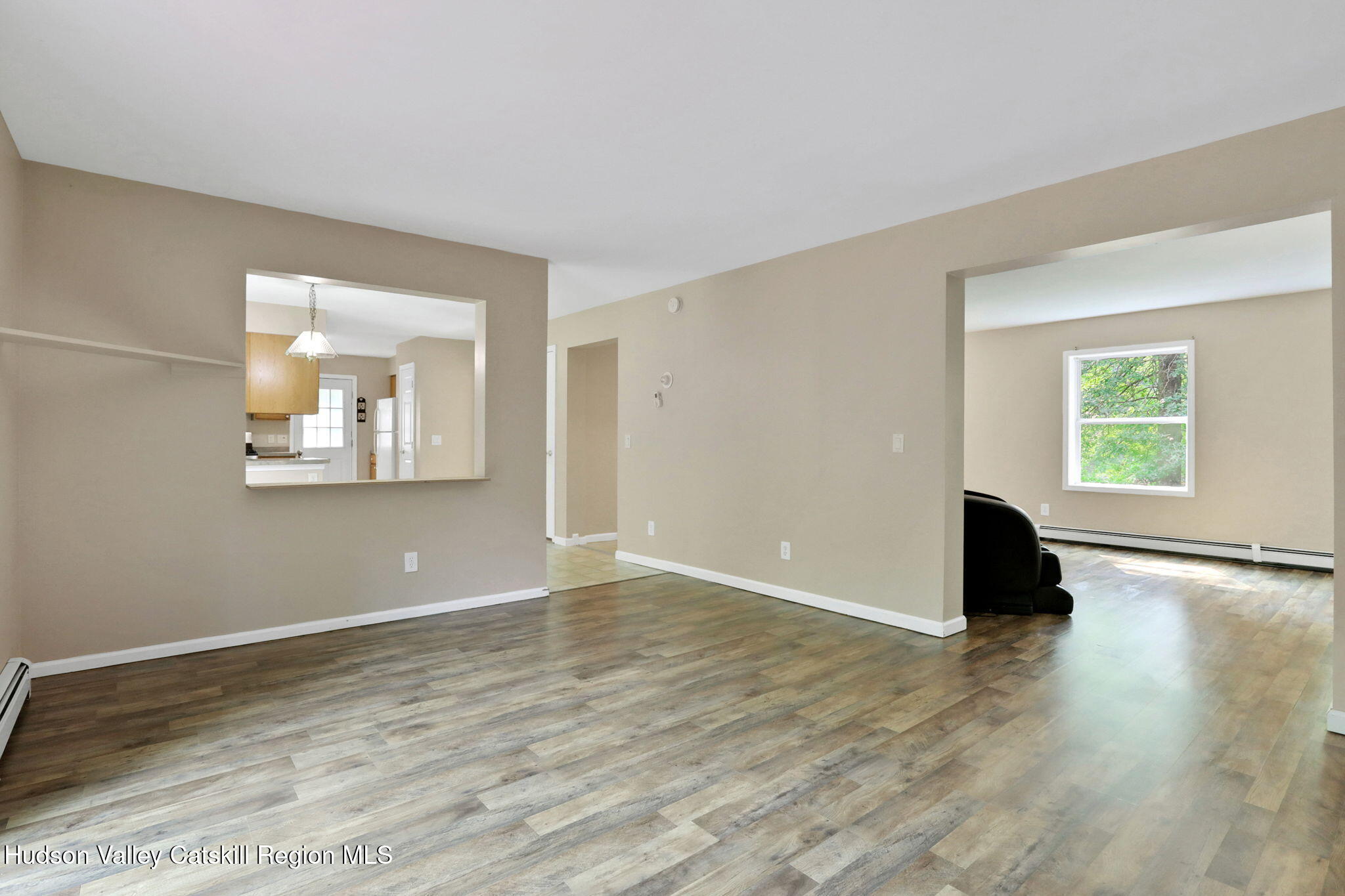 10 Lairds Court Purling, NY 12470 - Photo 11 of 25 an empty room with wooden floor and windows