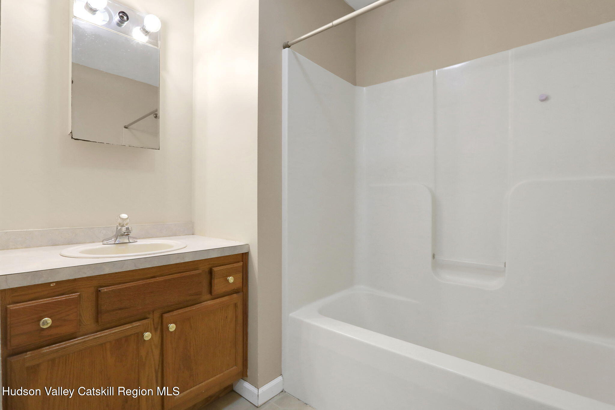 10 Lairds Court Purling, NY 12470 - Photo 17 of 25 a bathroom with a sink a mirror and a bathtub