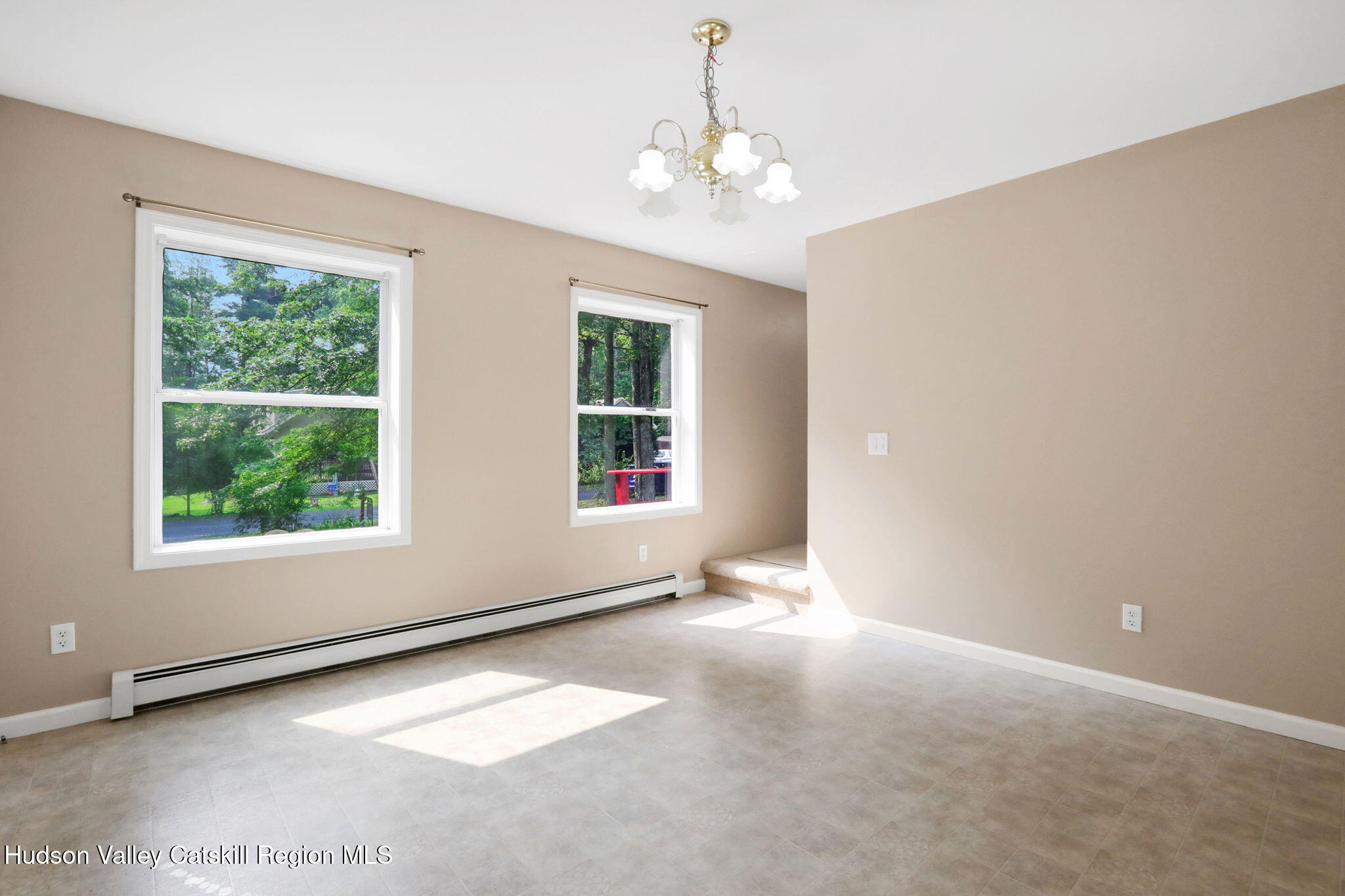 10 Lairds Court Purling, NY 12470 - Photo 4 of 25 an empty room with windows and entrance