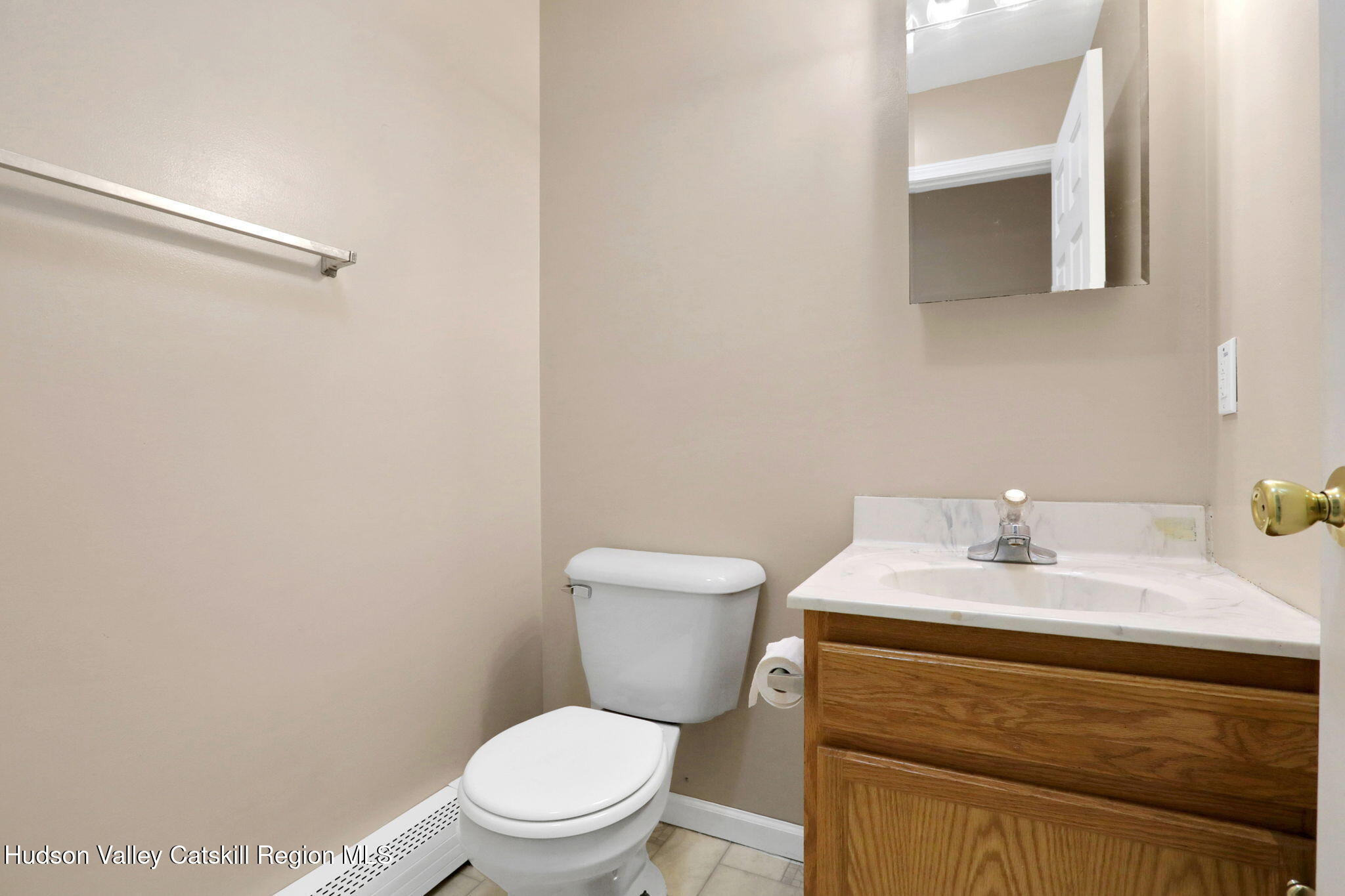 10 Lairds Court Purling, NY 12470 - Photo 9 of 25 a bathroom with a sink mirror vanity and toilet