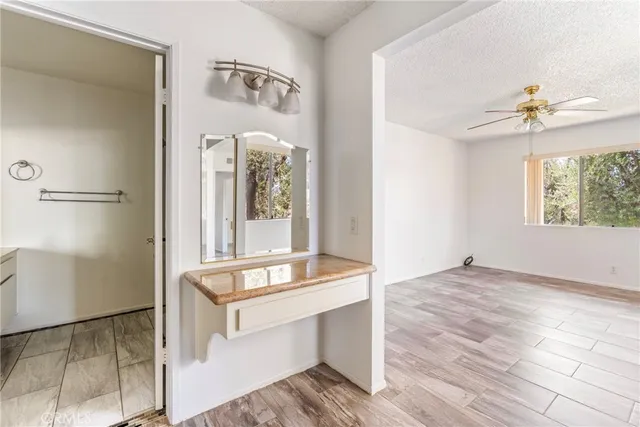 a view of room with window and wooden floor