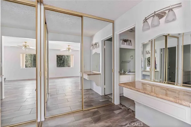 a bathroom with a glass shower door and a bathtub