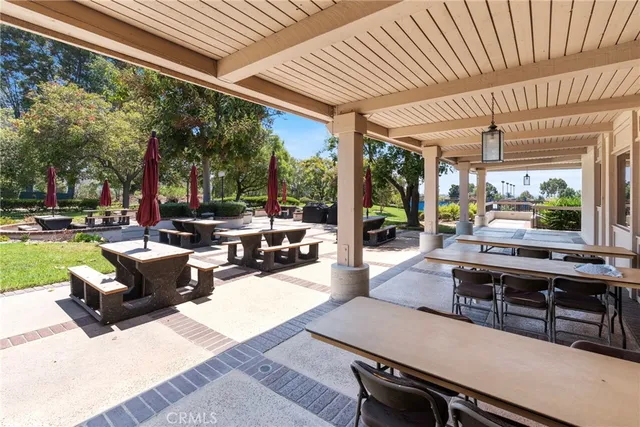 a building outdoor space with patio furniture and garden