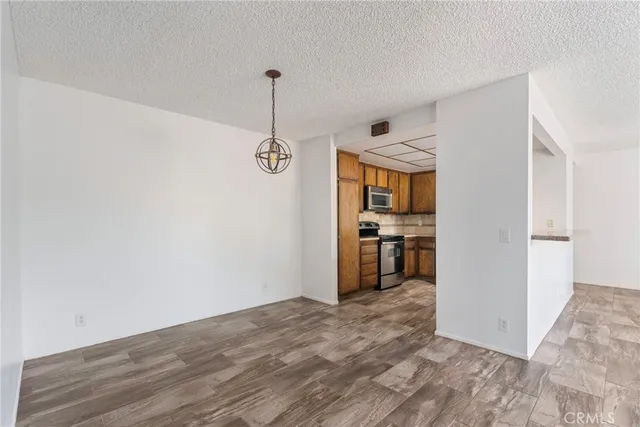 a view of a kitchen cabinets and wooden floor