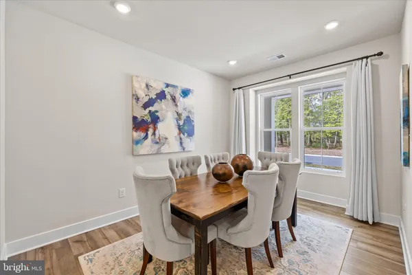 a living room with furniture and a washer dryer