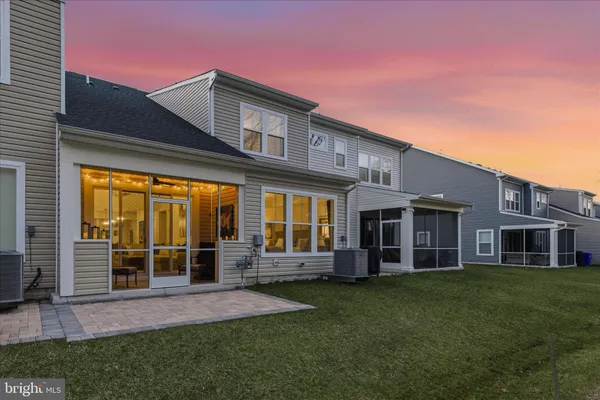 a view of a house with a garden and plants