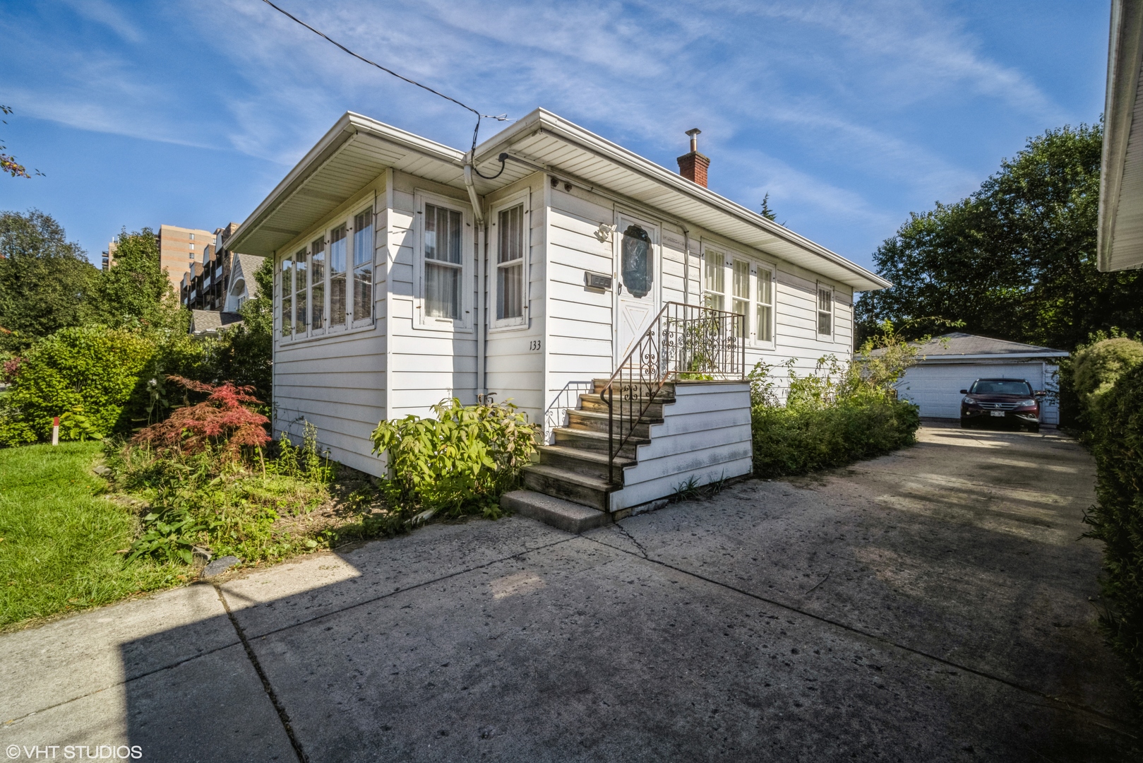 a front view of a house with garden