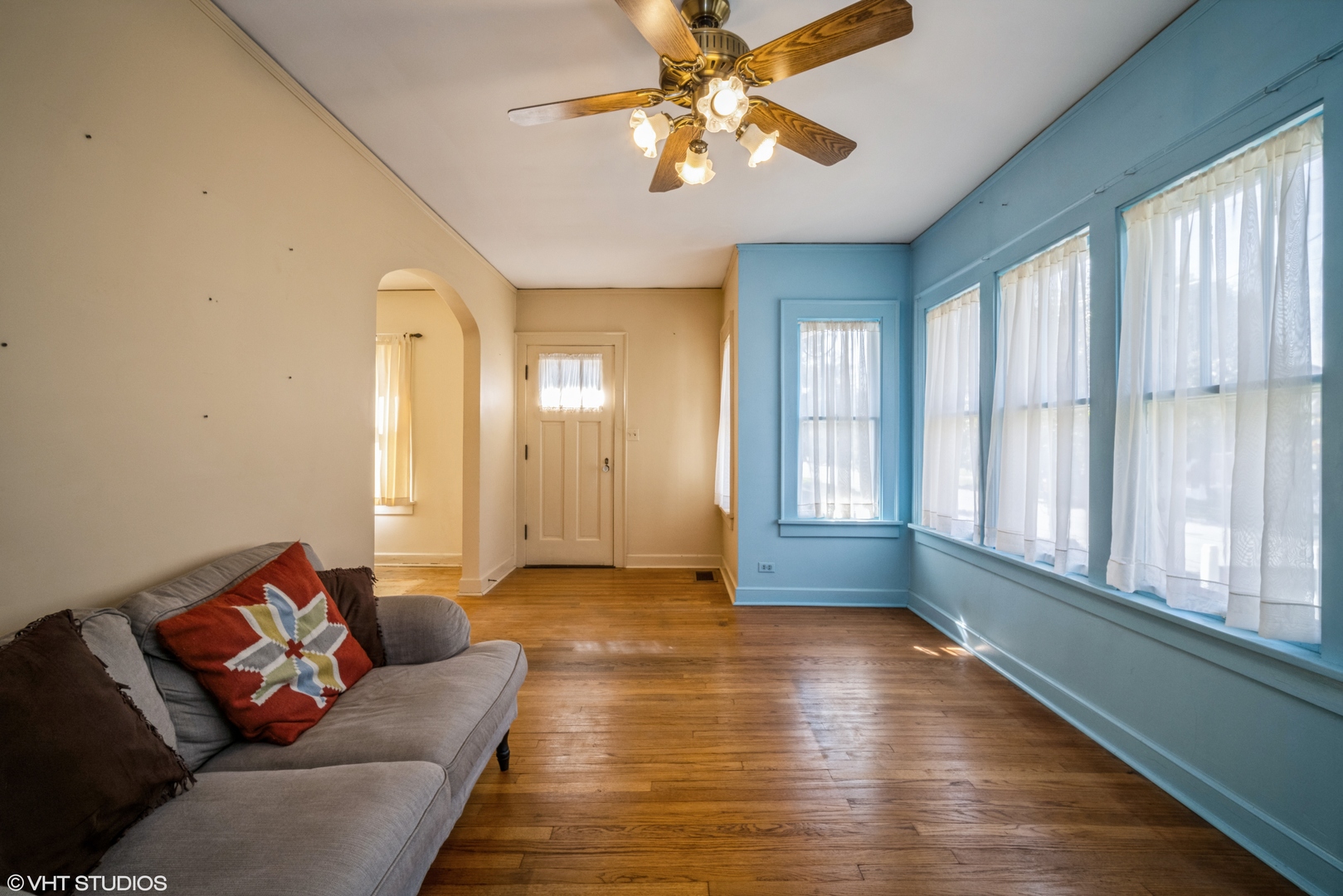 133 South Vail Avenue Arlington Heights, IL 60005 - Photo 2 of 13 a living room with furniture and a large window
