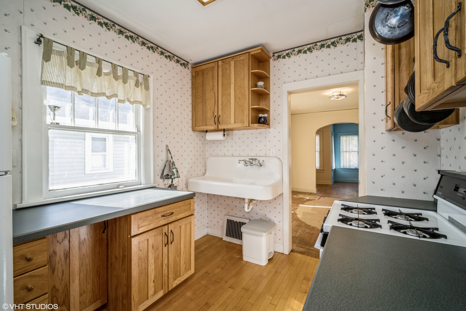 133 South Vail Avenue Arlington Heights, IL 60005 - Photo 5 of 13 a kitchen with stainless steel appliances a stove a sink and a microwave