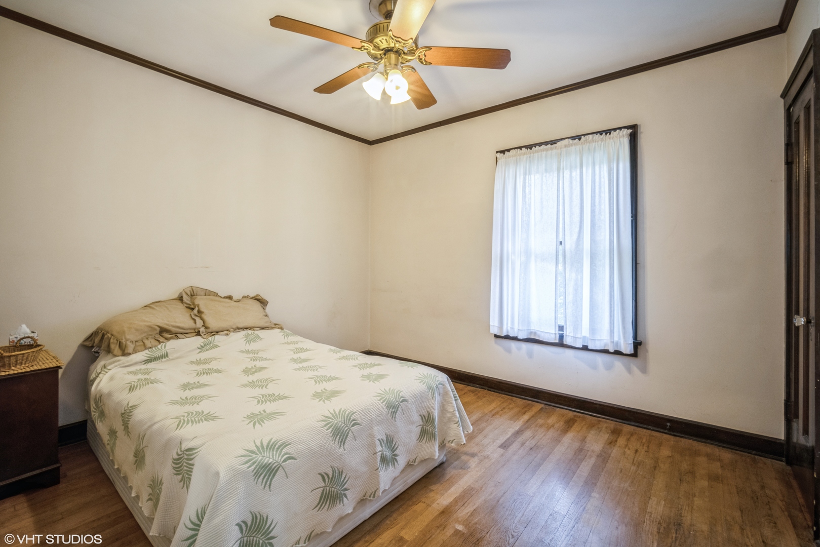 133 South Vail Avenue Arlington Heights, IL 60005 - Photo 8 of 13 a bed sitting in a bedroom next to a window