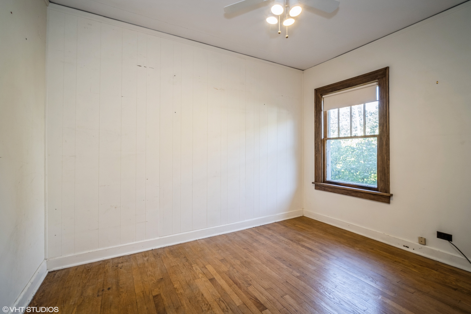133 South Vail Avenue Arlington Heights, IL 60005 - Photo 10 of 13 a view of an empty room with wooden floor and a window