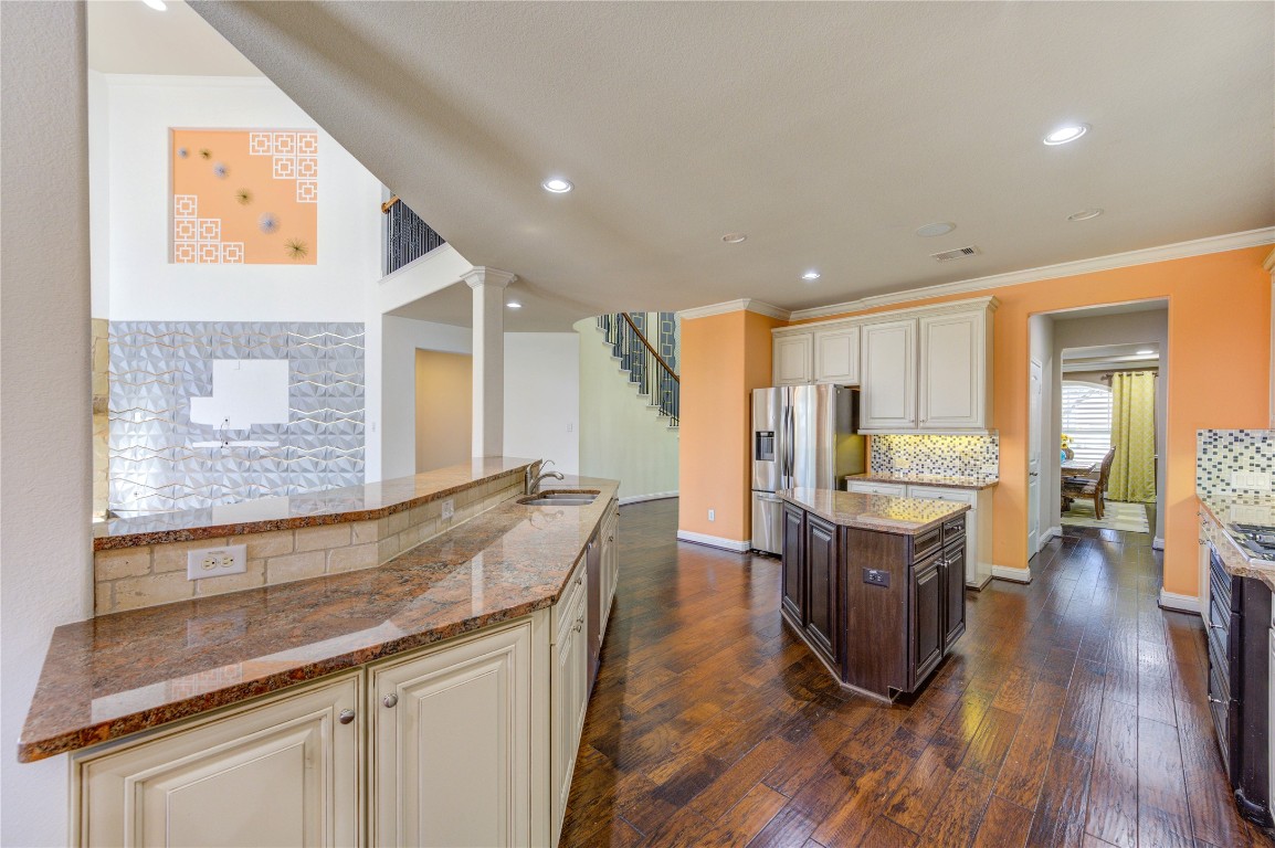 3806 Sims Pointe Court Fulshear, TX 77441 - Photo 15 of 50 a living room with stainless steel appliances granite countertop furniture wooden floor and a window