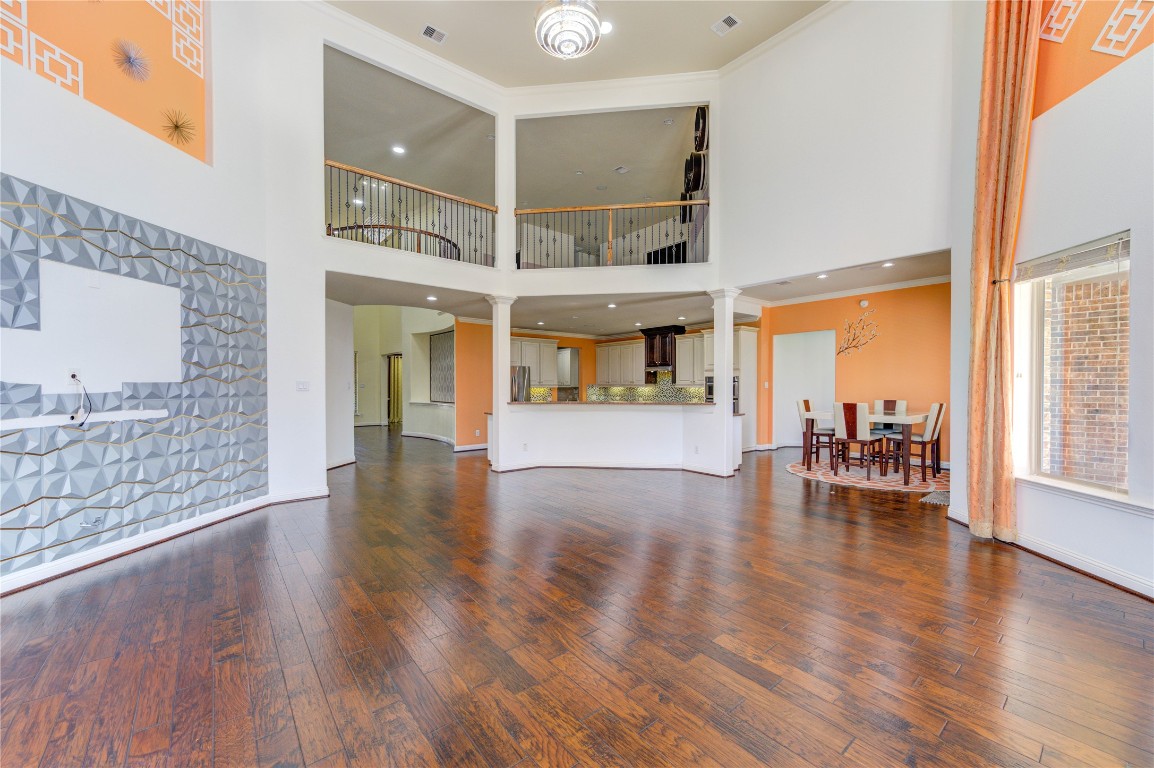3806 Sims Pointe Court Fulshear, TX 77441 - Photo 22 of 50 a view of dining room with furniture and wooden floor