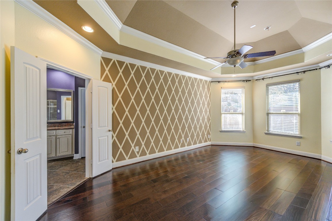 3806 Sims Pointe Court Fulshear, TX 77441 - Photo 26 of 50 a view of an empty room with wooden floor and a window