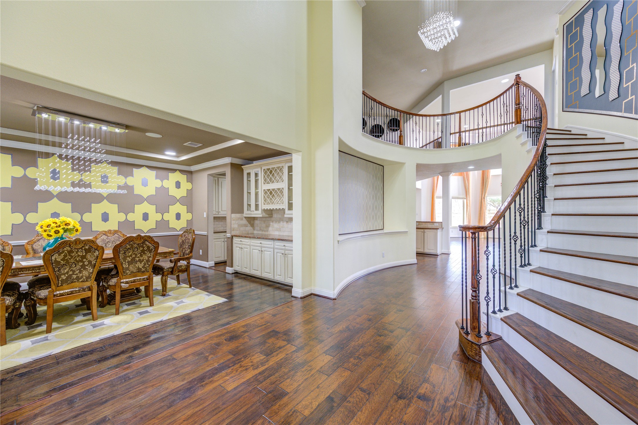 3806 Sims Pointe Court Fulshear, TX 77441 - Photo 3 of 50 a view of a hallway with wooden floor and stairs