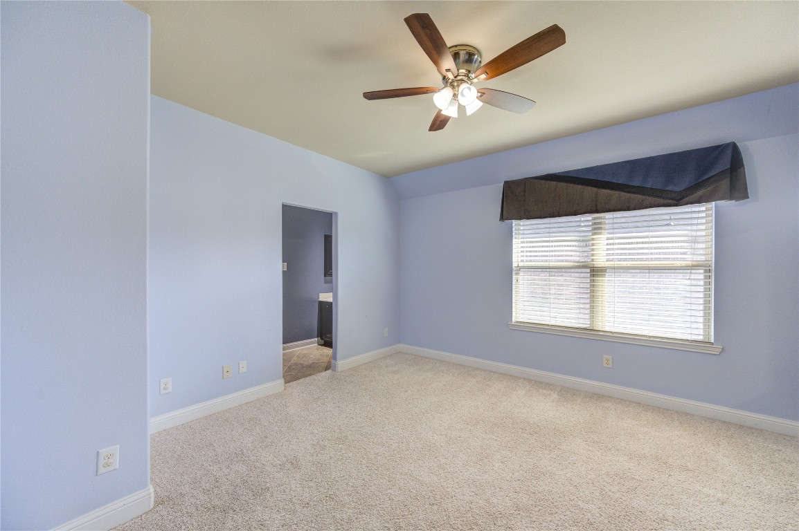 3806 Sims Pointe Court Fulshear, TX 77441 - Photo 36 of 50 a view of a livingroom with a ceiling fan and window