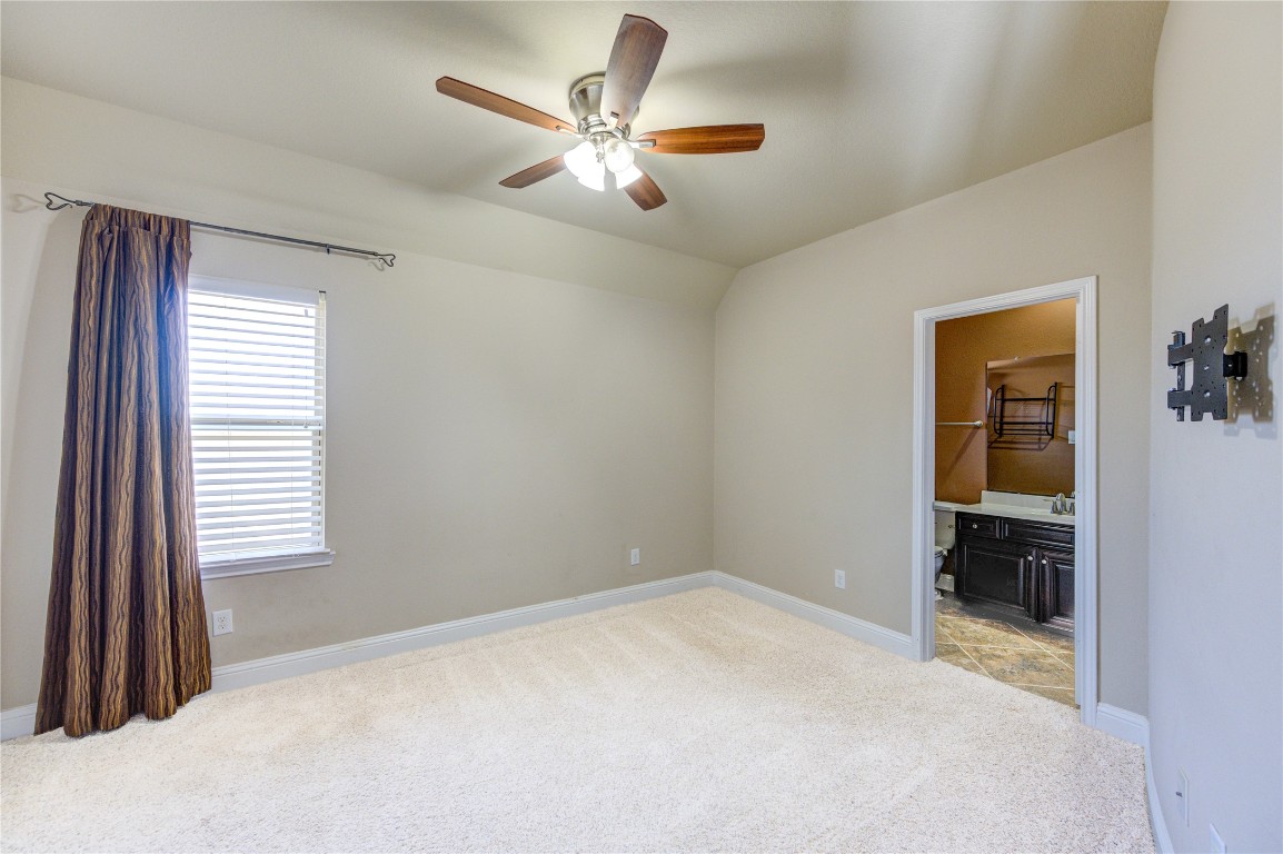 3806 Sims Pointe Court Fulshear, TX 77441 - Photo 39 of 50 a view of a livingroom with a ceiling fan and window